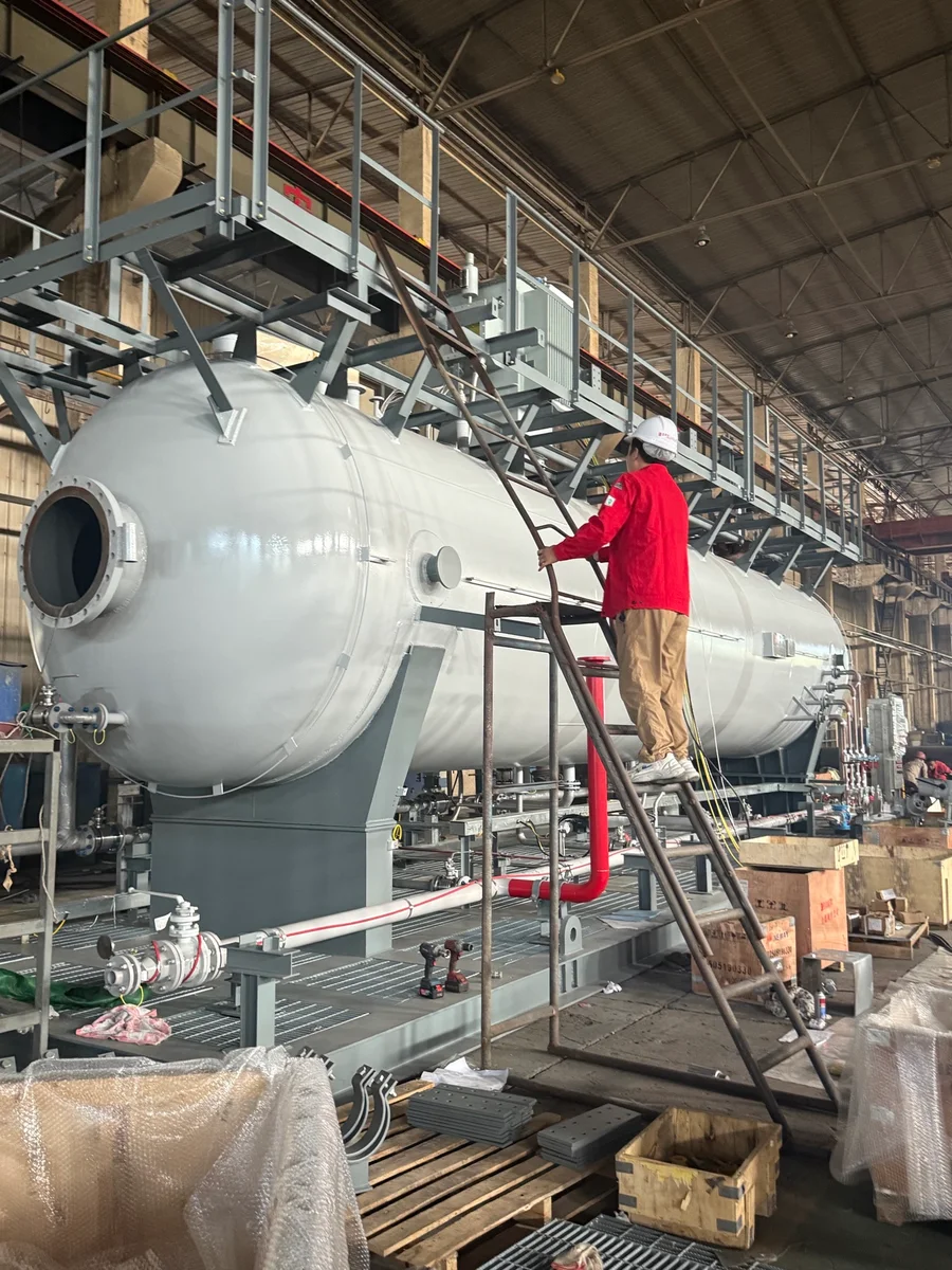 Personnel reviewing an assembled desalter unit